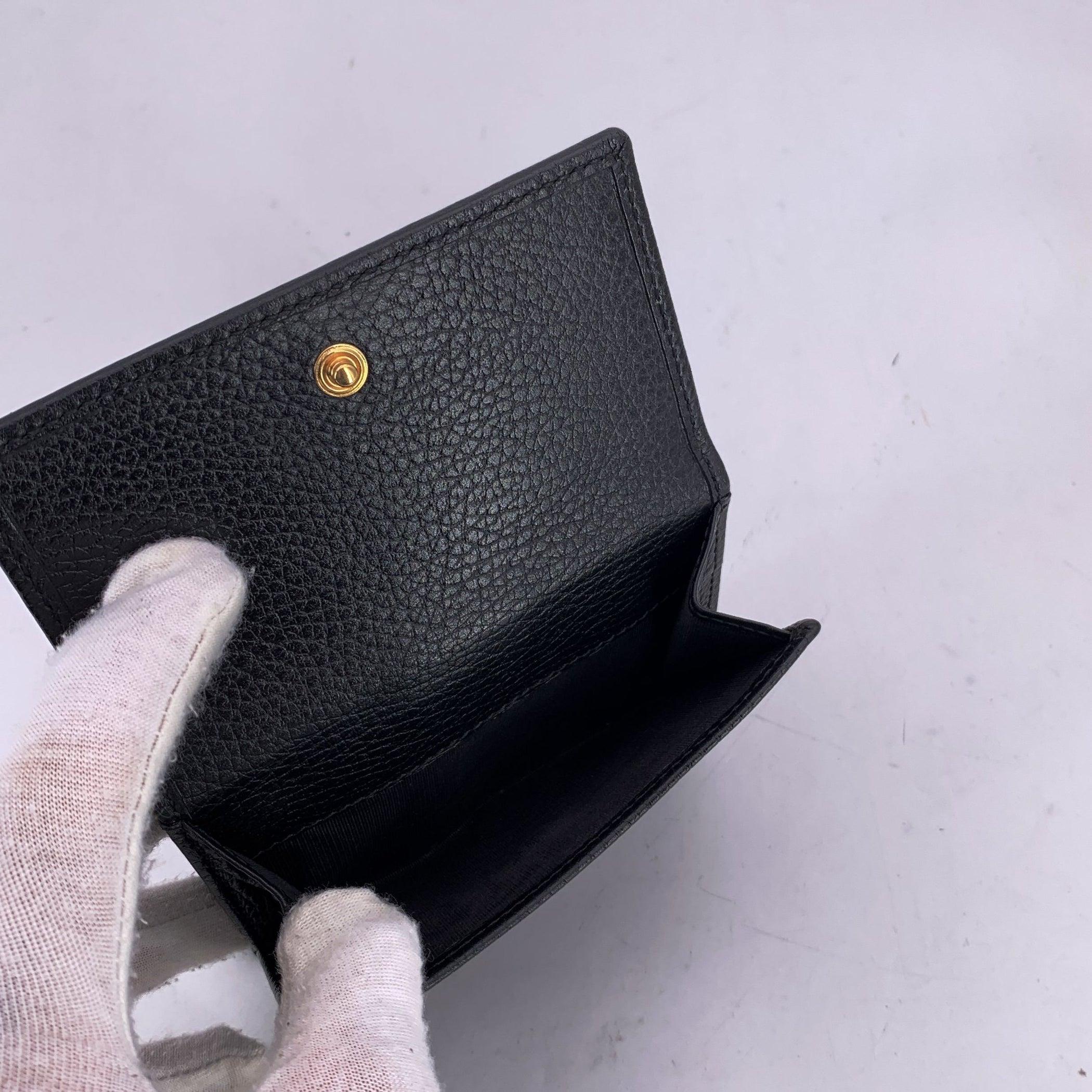 Portafoglio compatto GG in pelle nera di Gucci in vendita 1