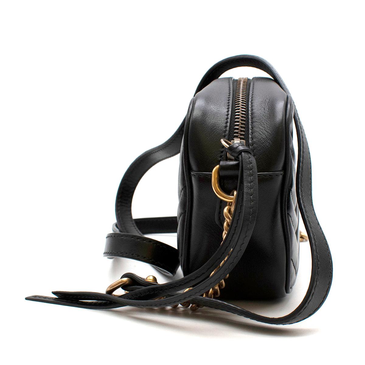 Gucci Black Leather GG Marmont Matelasse Mini Crossbody Bag

- Made of soft leather 
- GG Marmont gold-tone logo plaque
- Matelasse quilted design
- Embroidered logo to the rear
- Leather and chain-link shoulder strap
- Top zip fastening
- Internal