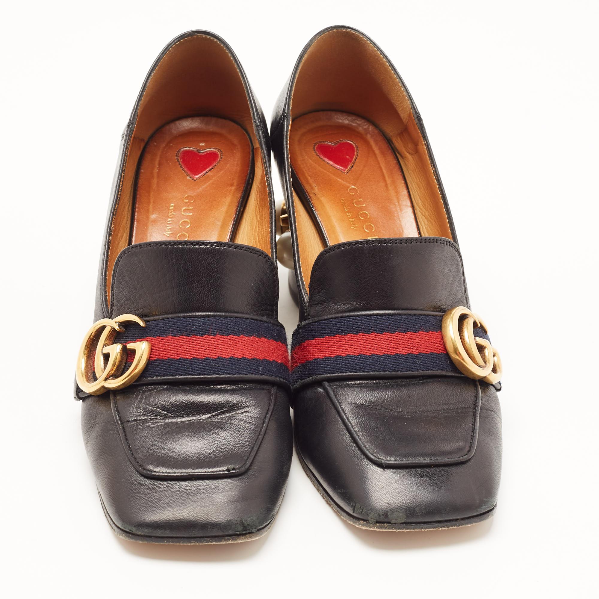 Advance your simple look with your choice of footwear. Choose creations as these Gucci loafer pumps that are made of leather and enhanced with embellishments on the block heels. The signature GG logo at the front brings in a fine finish.

Includes: