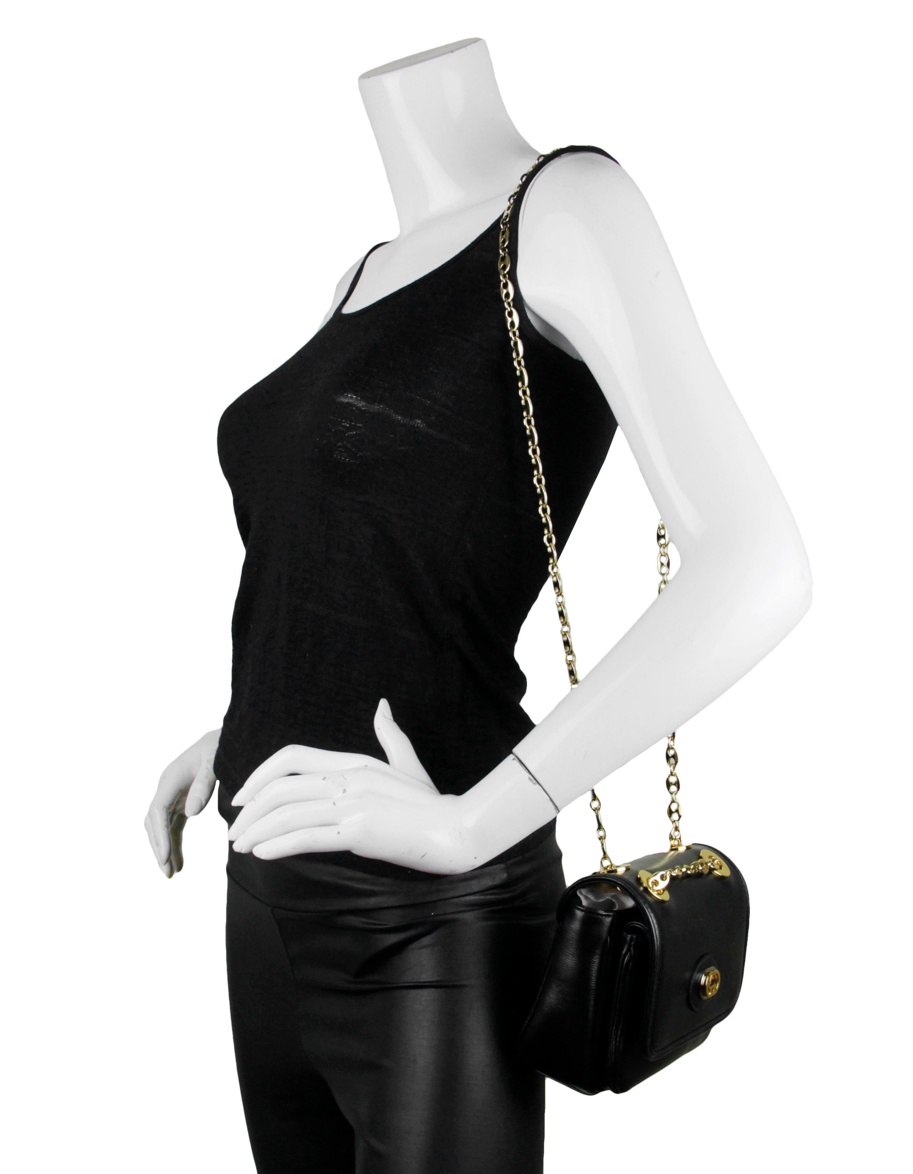Gucci Black Leather GG Mini Marina Chain Shoulder Bag. Chain can be doubled on the shoulder or singled to be worn as a crossbody. Style number 576423 467891. 

Made In: Italy
Color: Black 
Hardware: Goldtone with silver detail at front logo