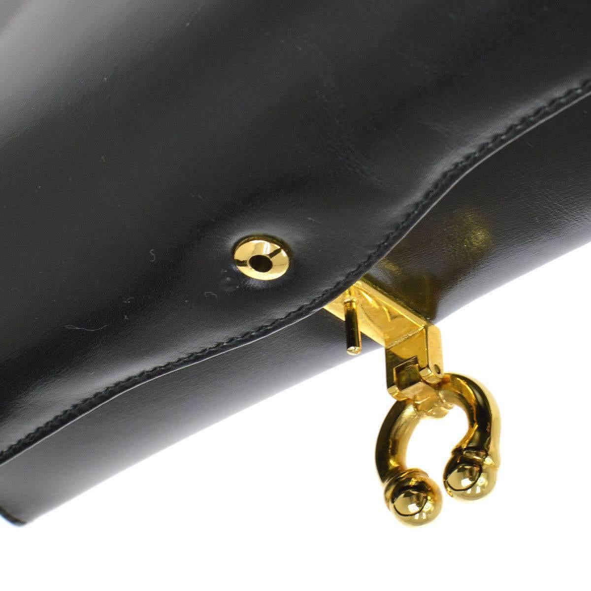 Gucci Black Leather Gold Kelly Style Party Evening Top Handle Satchel Bag

Leather
Gold tone hardware
Leather lining 
Turnlock closure 
Made in Italy
Handle drop 6