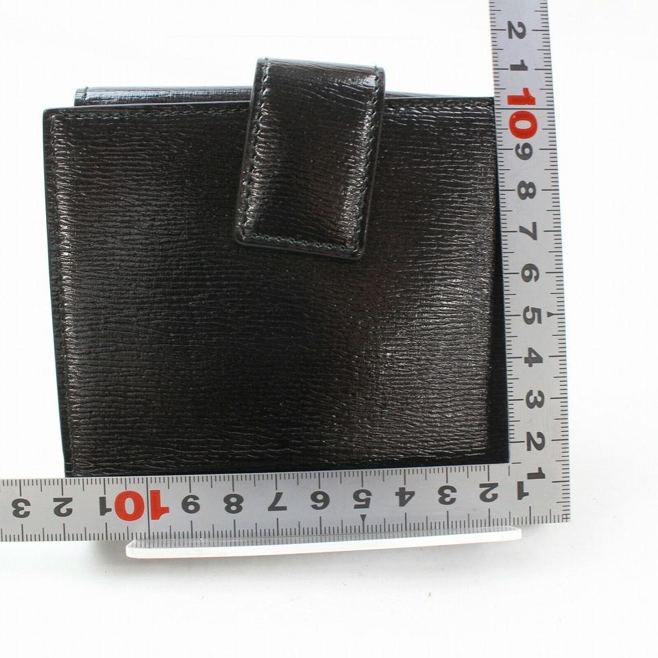 Portefeuille compact 871279 Gucci en cuir noir avec logo en forme de cœur en vente 1