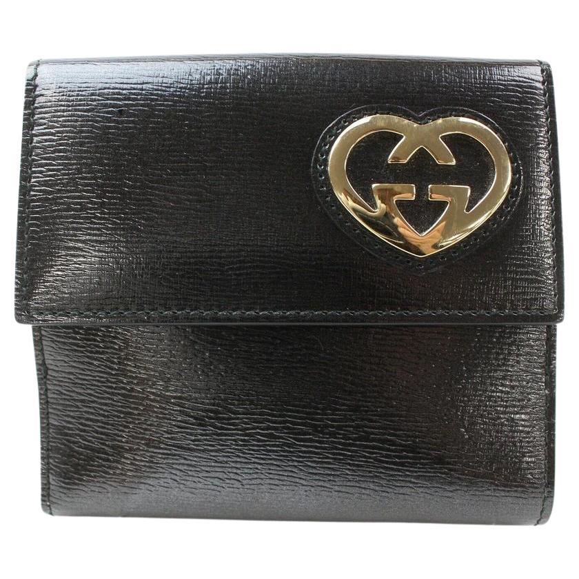 Portefeuille compact 871279 Gucci en cuir noir avec logo en forme de cœur en vente