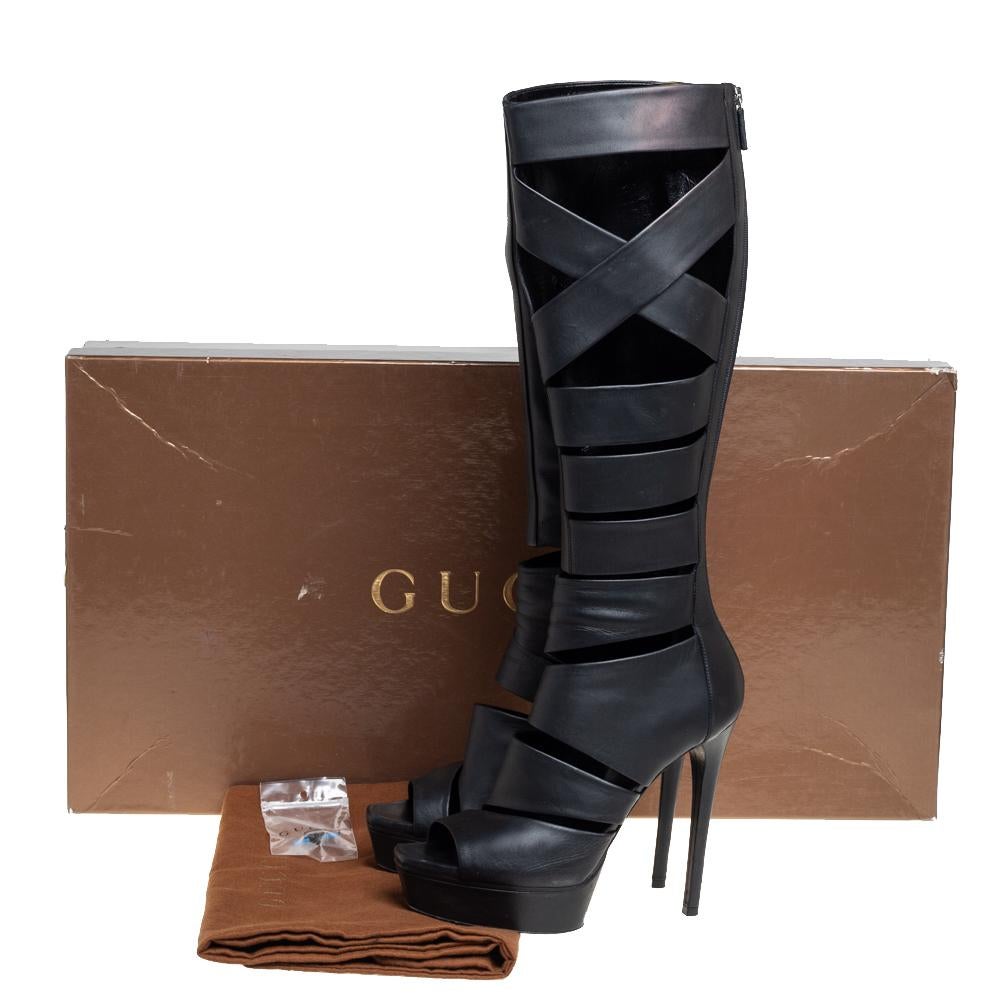 Luxurious and sophisticated, these knee-high boots from Gucci are a must-buy for the fashionable you. These black boots are crafted from leather and designed in a Gladiator style with cutouts, back zippers, and platforms with 14 cm heels.

Includes: