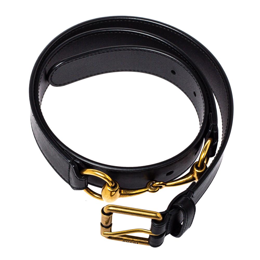 Add the touch of luxury to your accessory collection with this belt from Gucci. It comes made from black leather and is designed with the signature Horsebit at the back and a sleek pink buckle in gold-tone at the center. Grab it right away!

