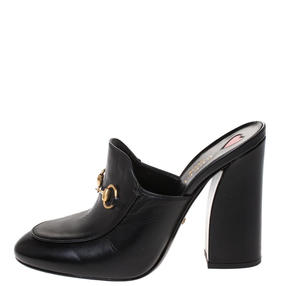 Theses Julie Princetown mules from the house of Gucci are masterfully designed in a black leather body with Horsebit accent on the vamps. They are set on comfortable block heels that can work all day or night. The understated appeal looks equally