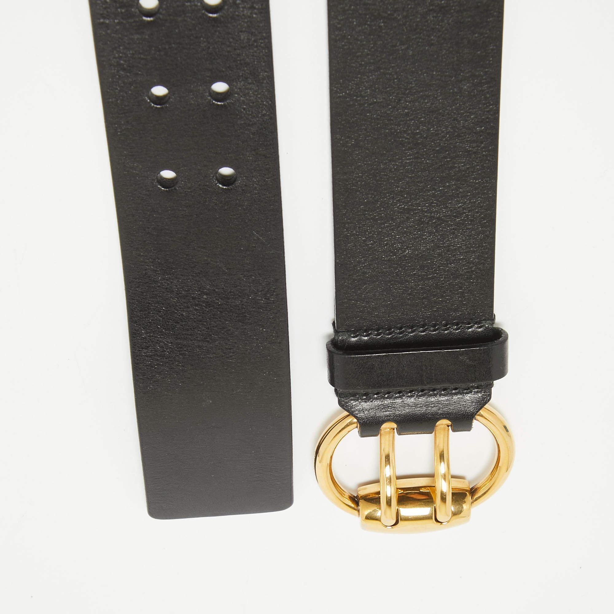 Add the luxury touch to your accessory collection with this waist belt from Gucci. It is made from black leather and designed with a gold tone double pin buckle.