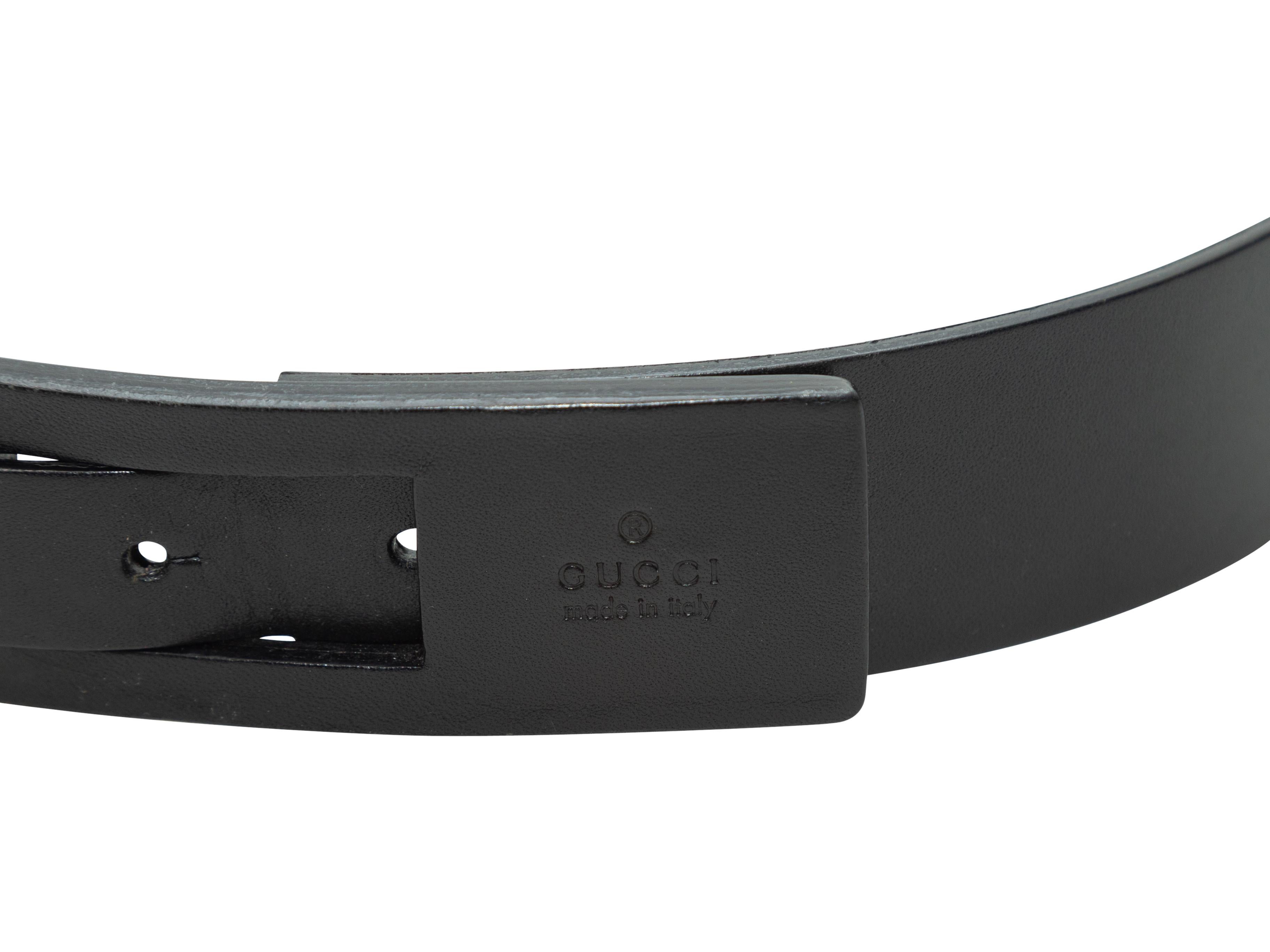 Product details: Black leather insert belt by Gucci. Peg-in-hole closure at front. 35