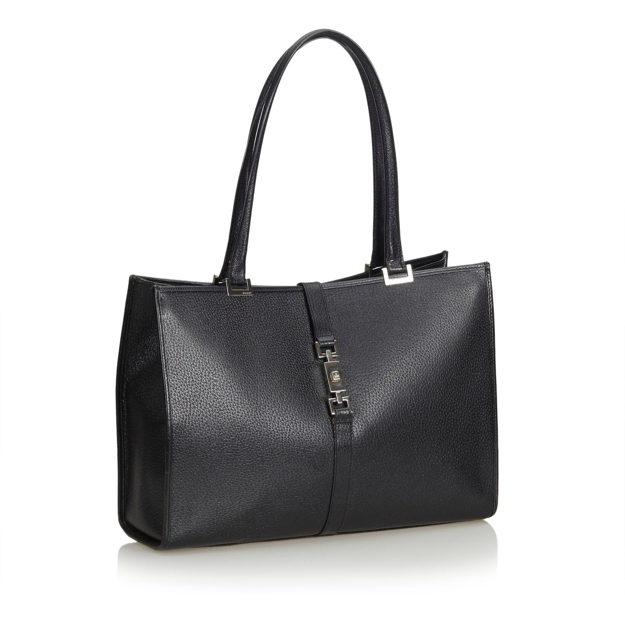 The Jackie tote features a leather body, rolled handles, a front strap with a push lock closure, an open top, and an interior zip pocket. It carries as B condition rating.

Inclusions: 
This item does not come with inclusions.

Dimensions:
Length: