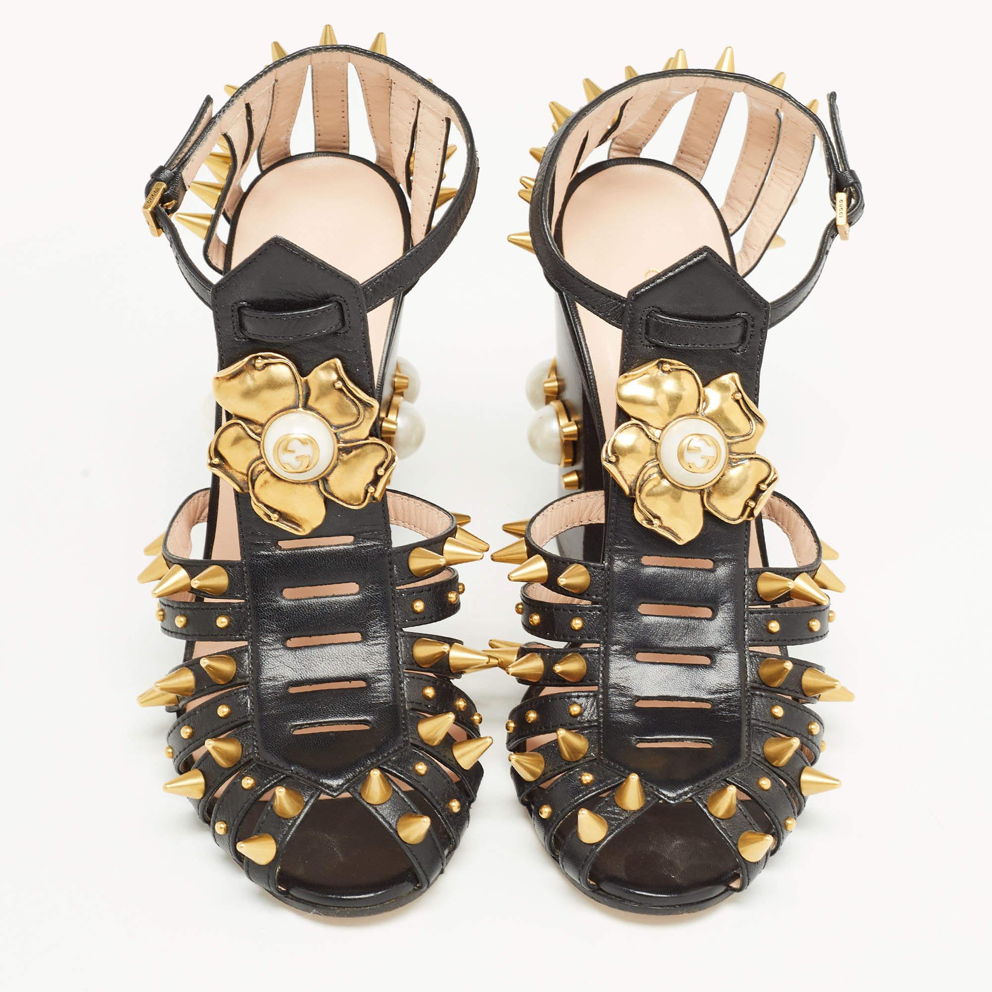 Gucci is well-known for its graceful designs, and the label is synonymous with opulence, femininity, and elegance. Crafted from leather in a black shade, the sandals are adorned with striking embellishments. They have been raised on sturdy