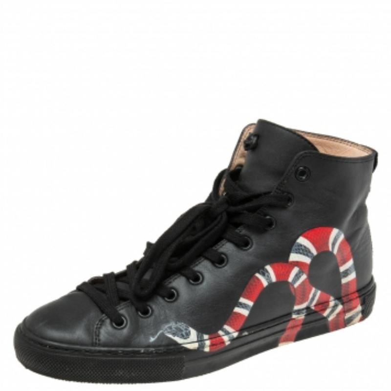 The house of Gucci's attraction for wildlife is evident from its menagerie of animal motifs seen across its collections. An eye-catching kingsnake motif is featured on the side panels of these high-top sneakers. They are crafted in black leather,