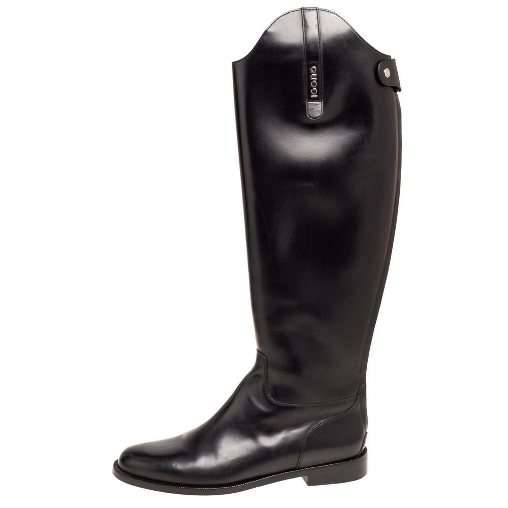 Creations as fashionable as this pair of knee-high boots from Gucci deserve to be in every woman's closet. They've been created from black leather and designed with round toes and low block heels. They are finished with zippers and silver-tone