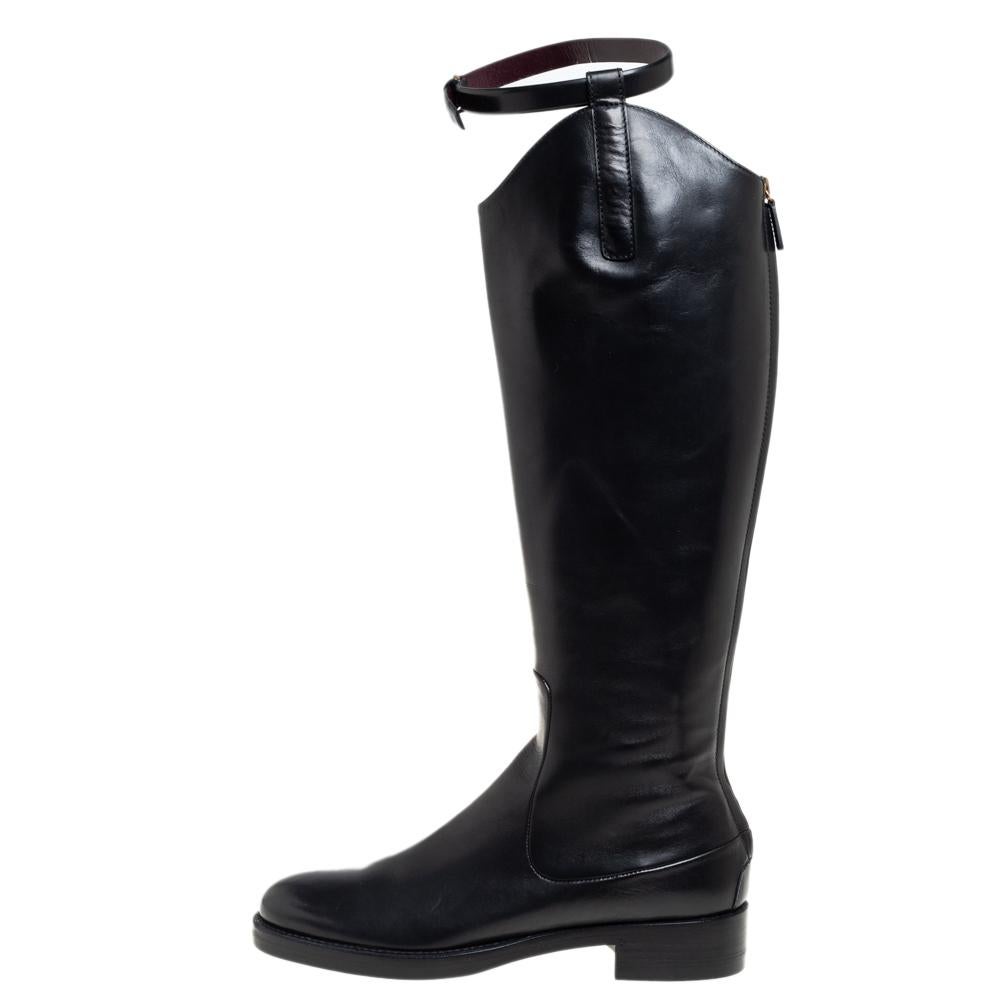 Creations from Gucci are always high on style. These black boots are crafted from quality leather and detailed with buckled straps, gold-tone hardware, and zippers at the back. They come equipped with comfortable leather-lined insoles and durable