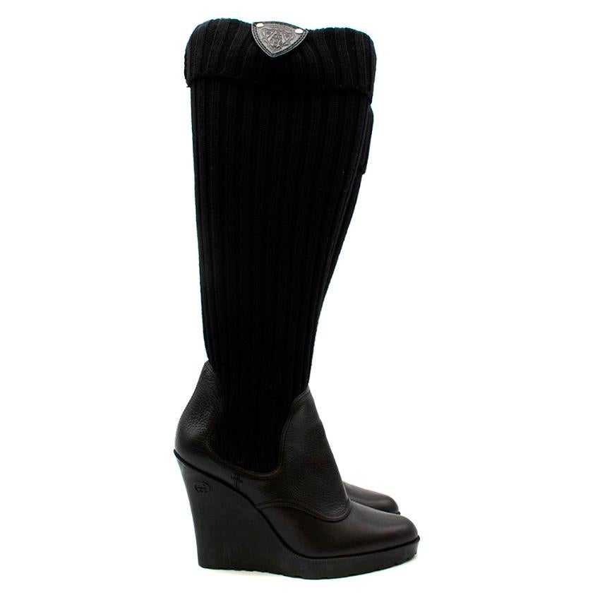 Gucci Black Leather & Knit Wedge Boots

-Made of soft leather and knit 
-Soft leather lining for comfort
-Iconic Interlocked GG logo to the wedge 
-Branded leather patch to the back 
-Rubber soles for adherence 
-Round toes 
-Neutral easy to style
