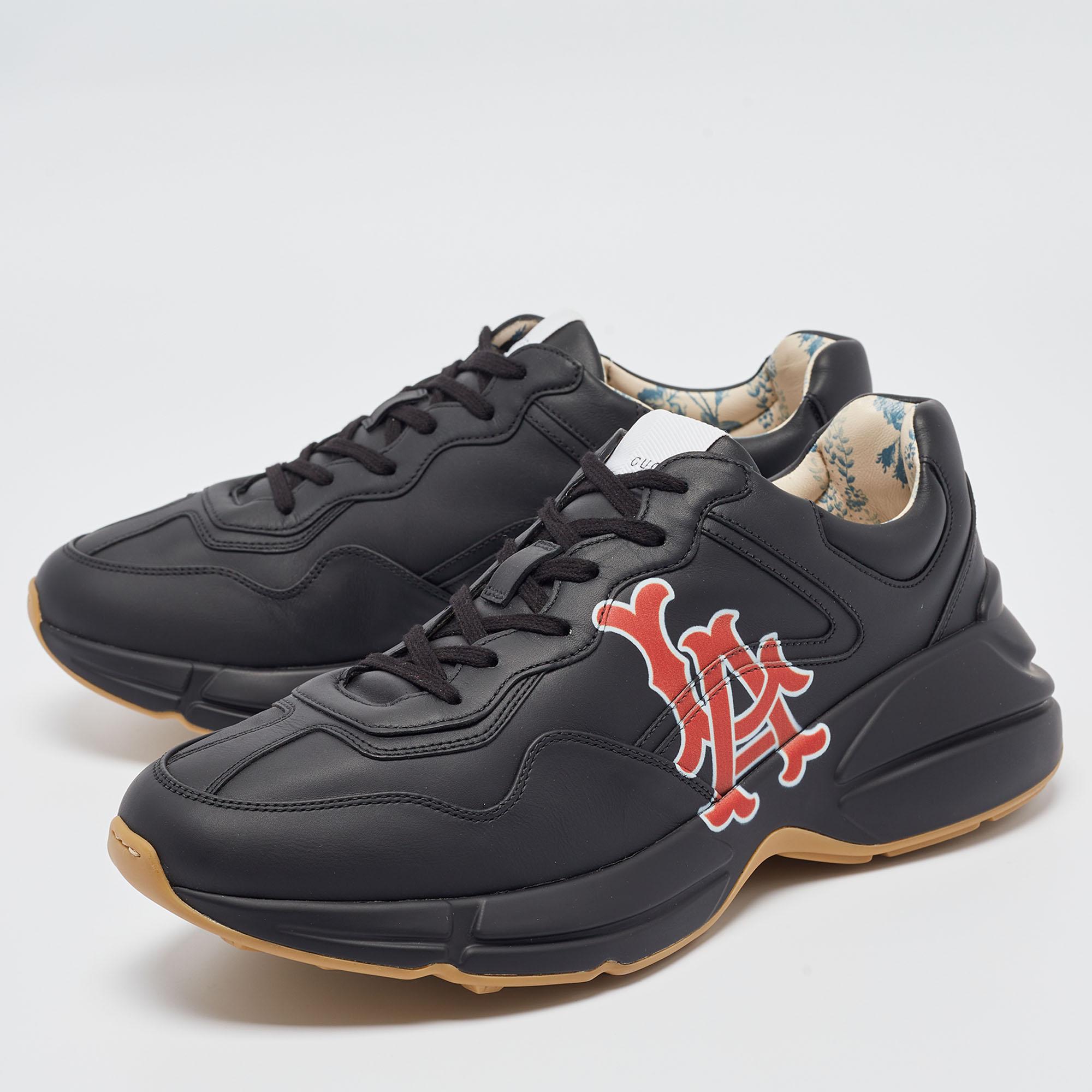 Designed into a chunky size, these Rhyton Gucci sneakers are not just stylish in appeal but also comfortable to wear. Crafted from leather, they are designed with LA Angels prints atop a black background on the sides. Finished off with laces on the