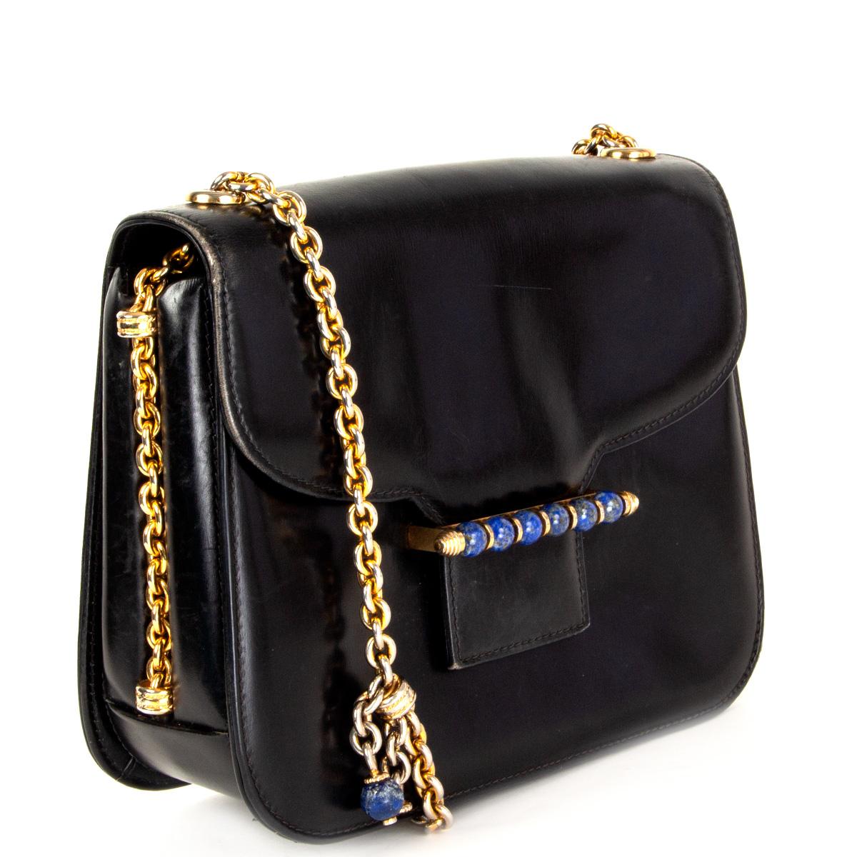 100% authentic Gucci Vintage Lapis Lazuli embellished shoulder bag (ca. 1960) in black box leather featuring gold-tone chain shoulder-strap and Lapis Lazuli embellishment at front. Lined in black leather with one zipper pocket against the back, two