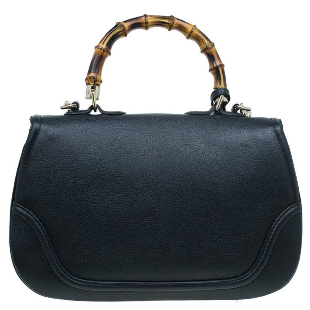 Chic and stylish, this Gucci bag looks distinct with its bamboo-inspired design. Crafted from black leather, it is provided with gold-tone hardware. It features top handle, a detachable shoulder strap, tassels, and a flap closure with bamboo