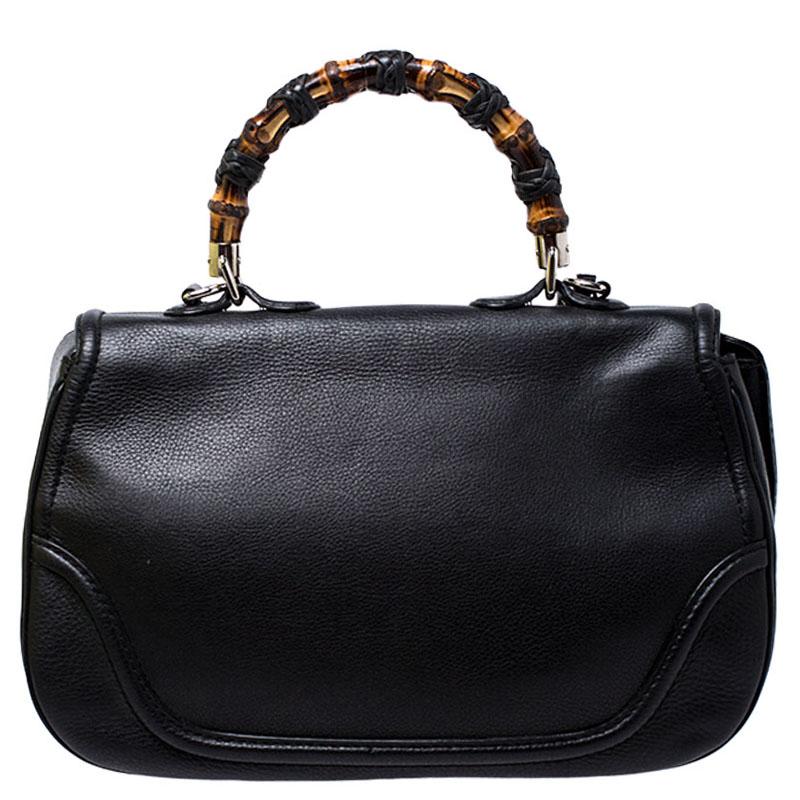 This Gucci bag combines style and elegance into the ultimate everyday bag. Crafted from leather, it is accented with signature bamboo top handle. Secured with a bamboo lock closure, the interior is lined with canvas and has one zipped pocket. The