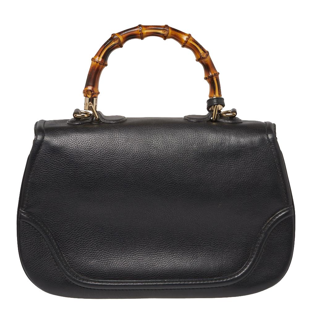 Chic and stylish, this Gucci bag looks distinct with its bamboo-inspired design. Crafted from black leather, it is provided with gold-tone hardware. It features top handle, a detachable shoulder strap, tassels, and a flap closure with bamboo