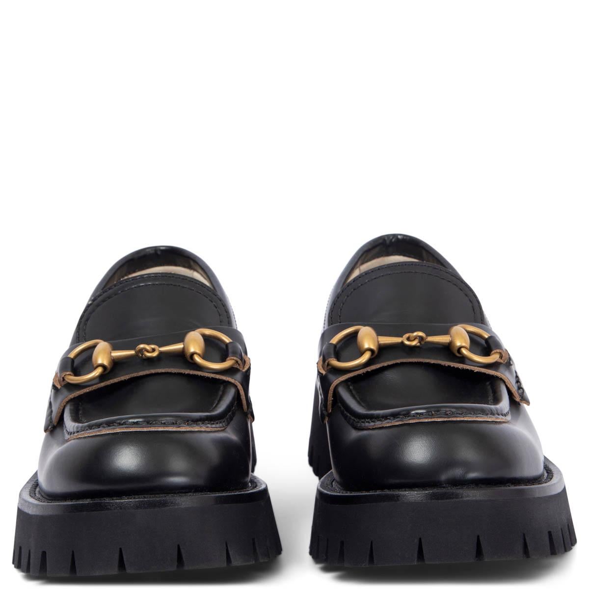 100% authentic Gucci Lug Sole Horsebit loafer in black smooth leather with gold embroidered bee on the back. Lined in blue rosebud print lining on the insole. A mainstay in Gucci history since the '50s, the classic Horsebit loafer bridges the past
