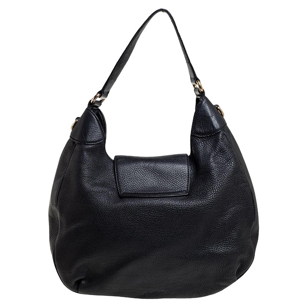 Crafted in leather, this Gucci Emily hobo is finished with a flap closure secured with a tassel detailed, gold-tone lock. It comes with a flat handle. It is ultra-spacious and can be a great alternative to your weekend travel bag.

