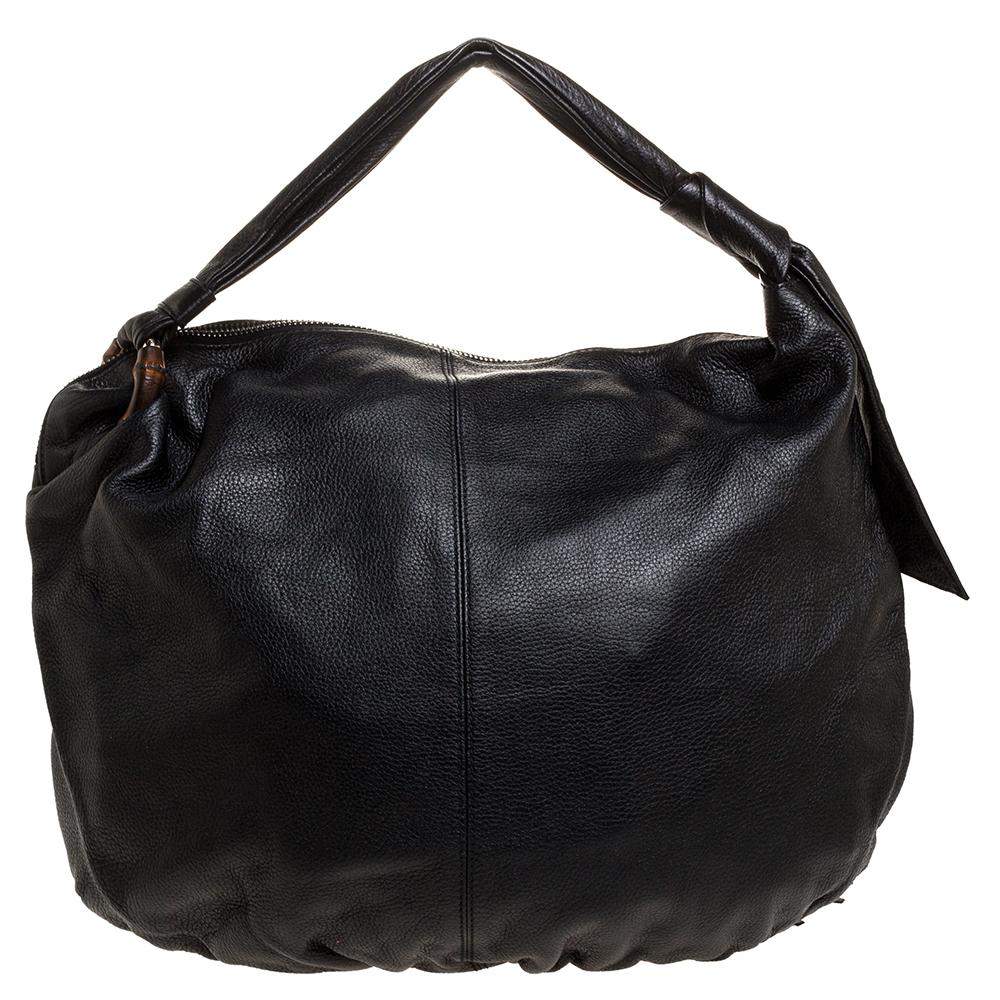 A handbag to last you years in great shape and state is this Jungle hobo from Gucci. Crafted from quality black leather in Italy, this gorgeous number has a spacious fabric-lined interior to assist you with ease. It features a single handle and a