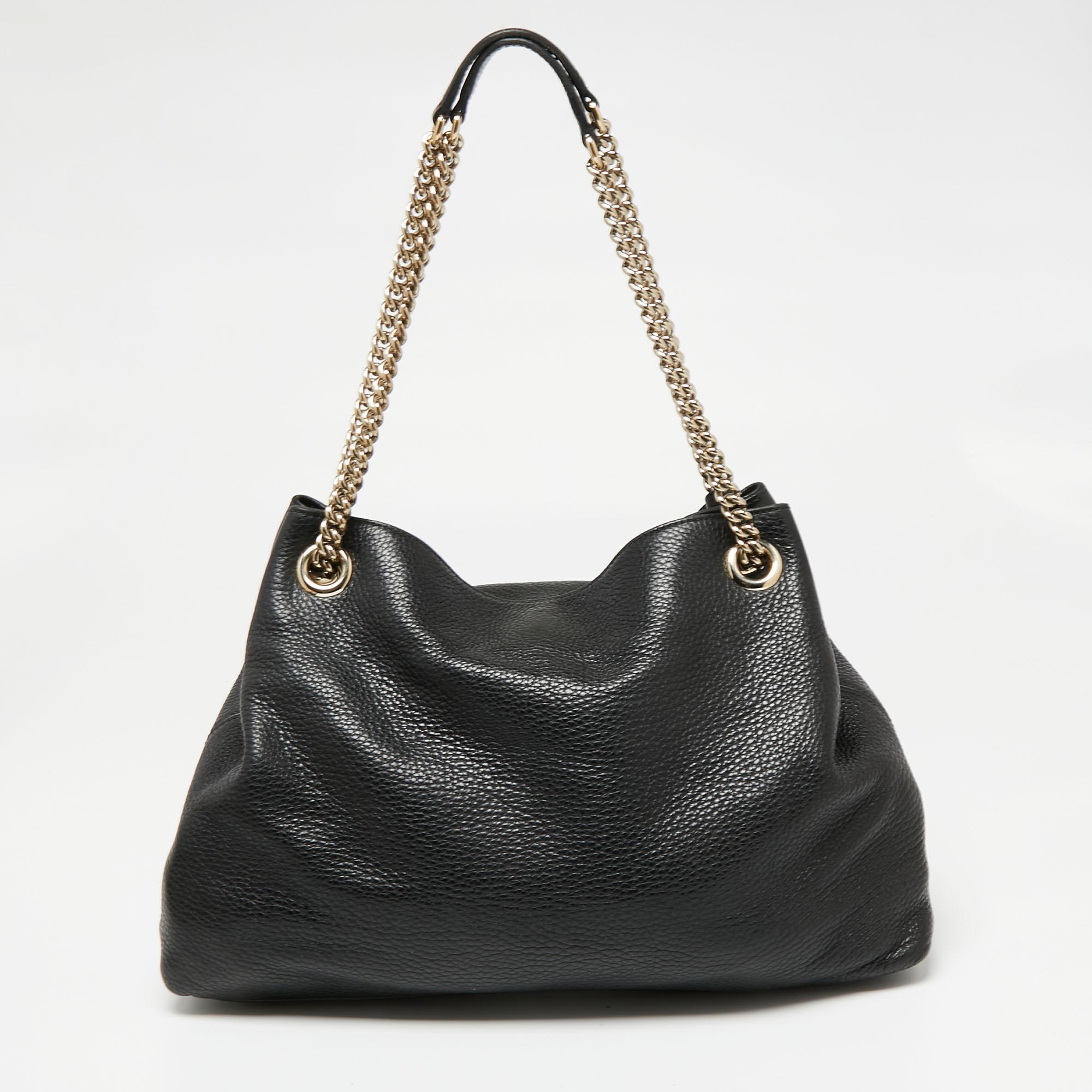 This Soho tote is one of the many designs by Gucci that is loved by women worldwide. The bag is constructed from leather and added with the signature GG on the front. It features a spacious canvas interior for your essentials, two chain handles with