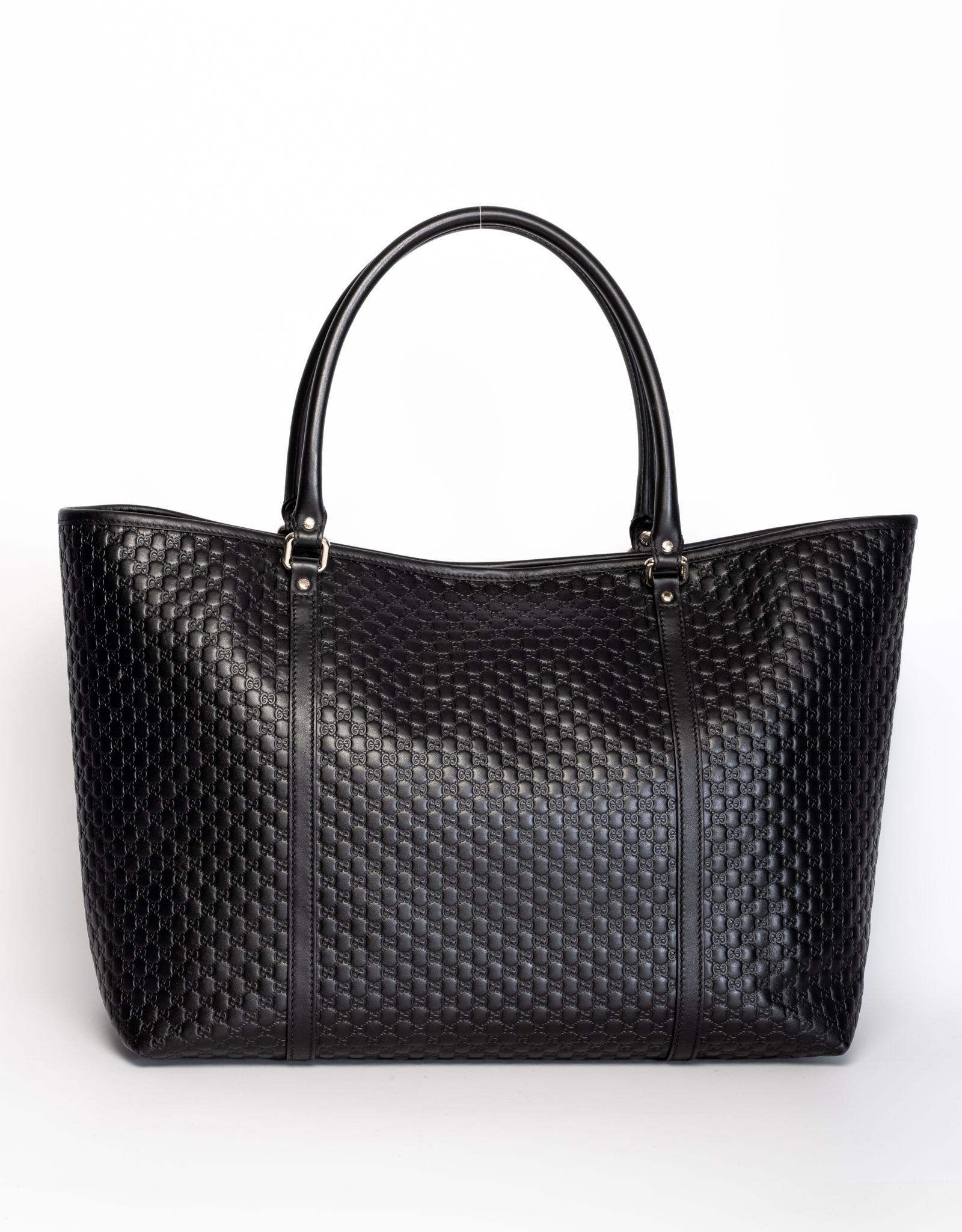 This large Gucci tote bag is made of black leather and embossed with micro Guccissima monogram. Featuring leather handles, brass hardware and leather trim.

COLOR: Black
MATERIAL: Leather
ITEM CODE: 449648 493075
MEASURES: H 12” x L 20” x D 8”
COMES