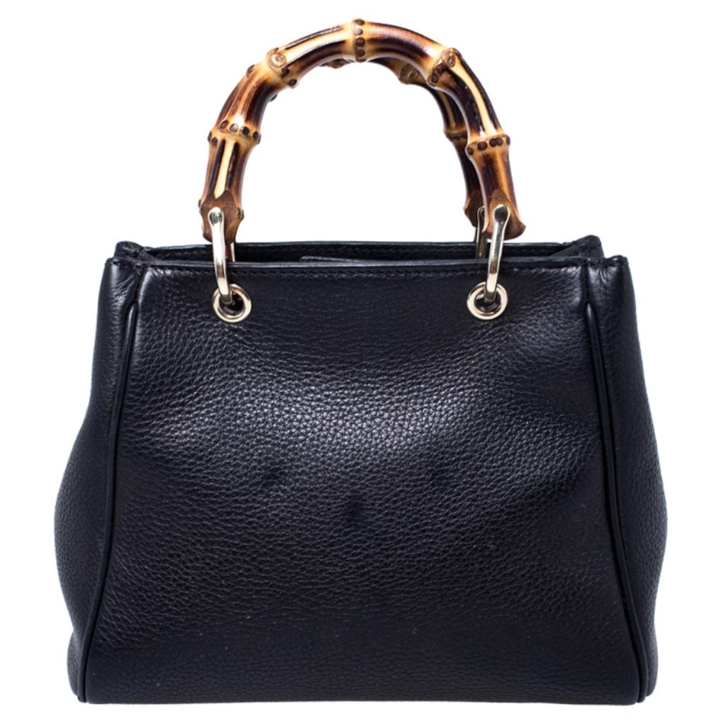 Handbags as fabulous as this one are hard to come by. So, own this gorgeous Gucci tote today and light up your closet! Crafted from black leather, this stunning number has a spacious fabric interior and is wonderfully held by a shoulder strap and