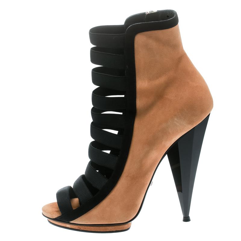 Let them do all the talking when you flaunt these Gucci booties on your next outing! The black Olimpia booties are crafted from leather and suede and feature a strappy layout. They flaunt side zippers and come equipped with comfortable insoles, 14