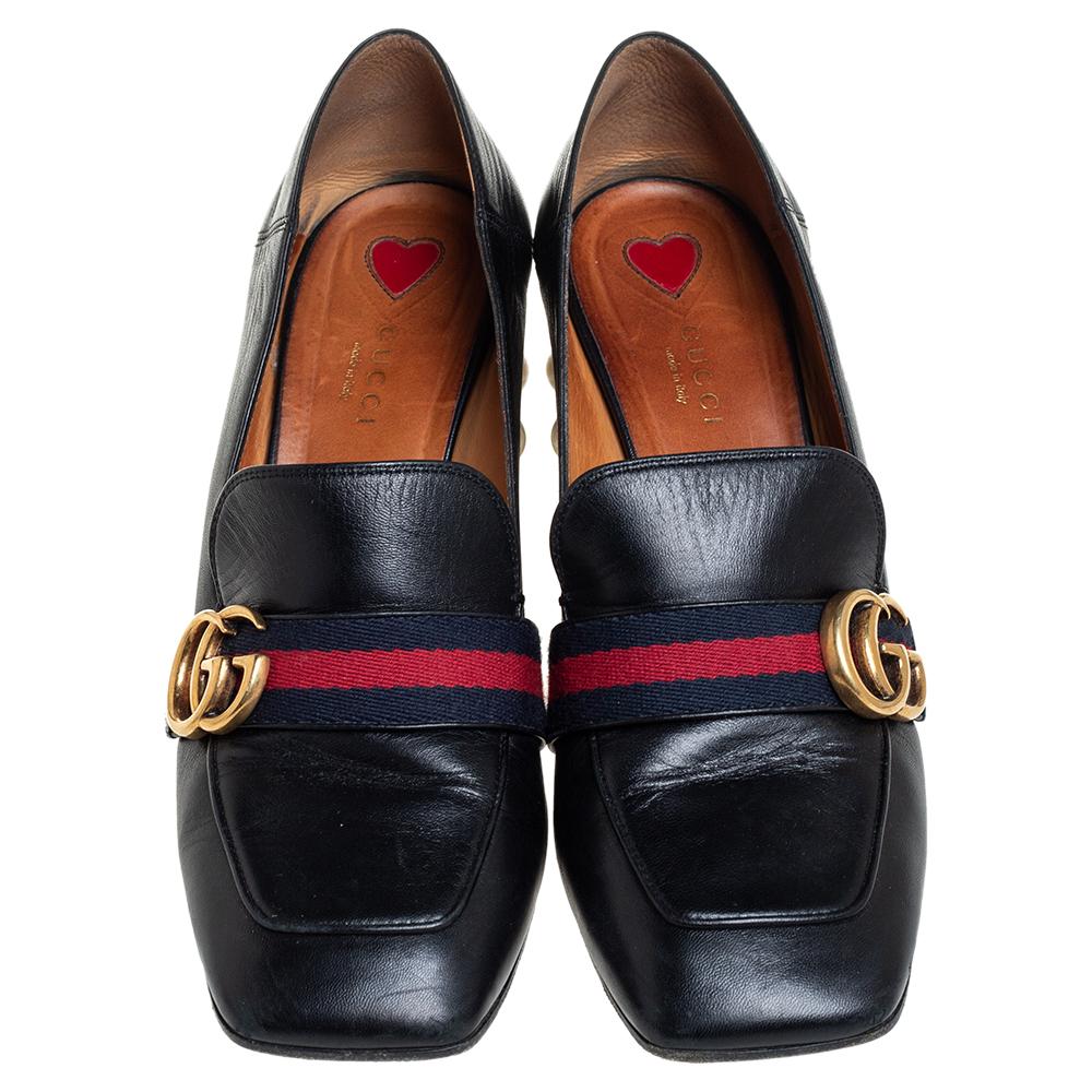 Brimming with signature details, these Gucci loafers crafted with leather will certainly bring you a stunning look. While the vamps are adorned with a gold-tone GG motif and the Web trim, the heels are decorated with faux GG pearls and studs. Revamp