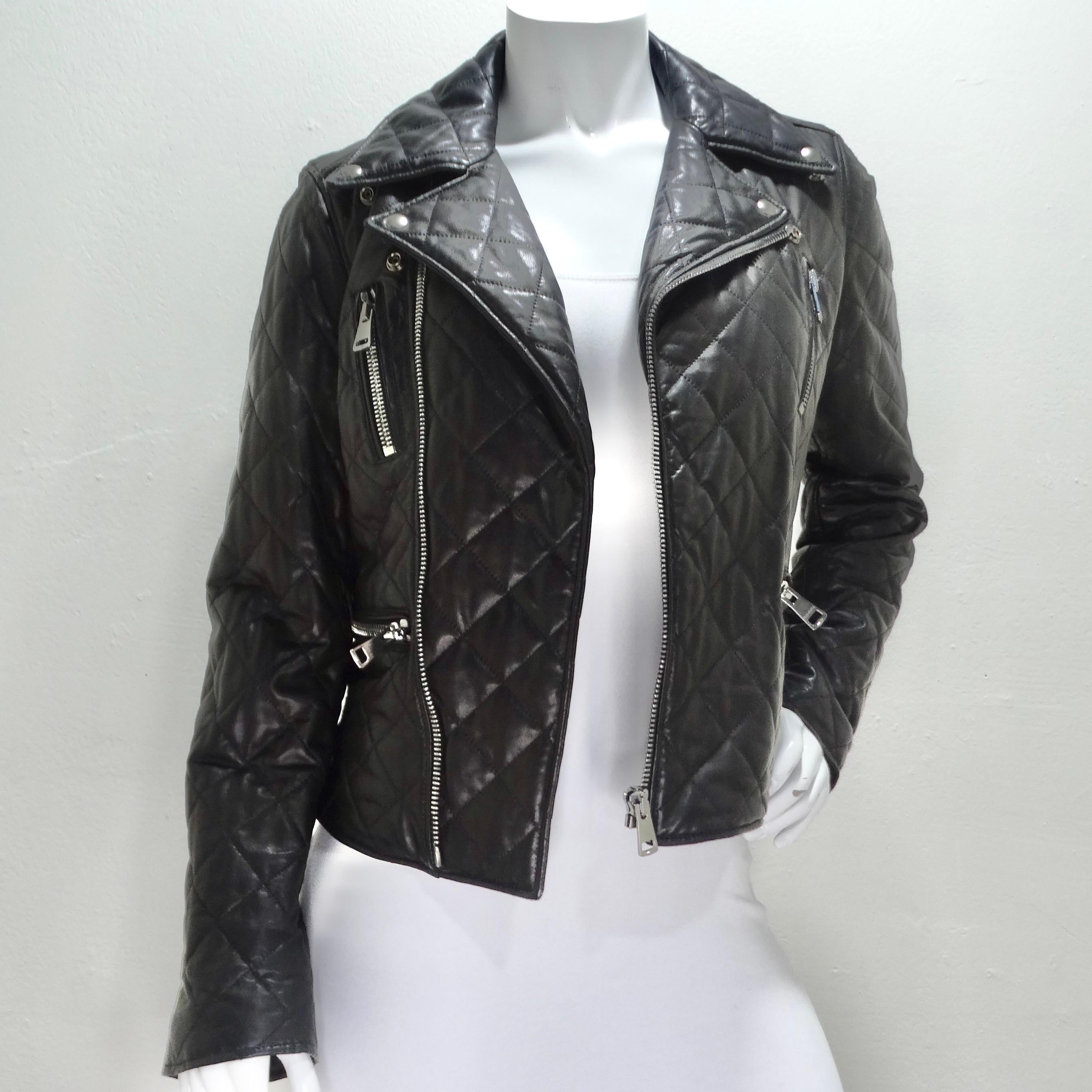 Introducing the epitome of luxury and style – the Gucci Black Leather Pearl Logo Moto Jacket. This classic Moto-style leather jacket is more than just a piece of clothing; it's a statement of sophistication and glamour. Crafted in Italy, this jacket