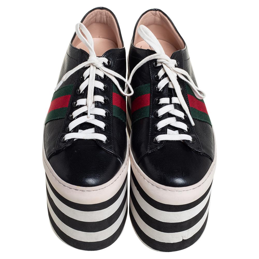 One's wardrobe is incomplete without a good pair of sneakers and what better than these Gucci ones! These Peggy sneakers have been crafted from black leather and styled with round toes, lace-up on the vamps, and the signature Web detailing on the