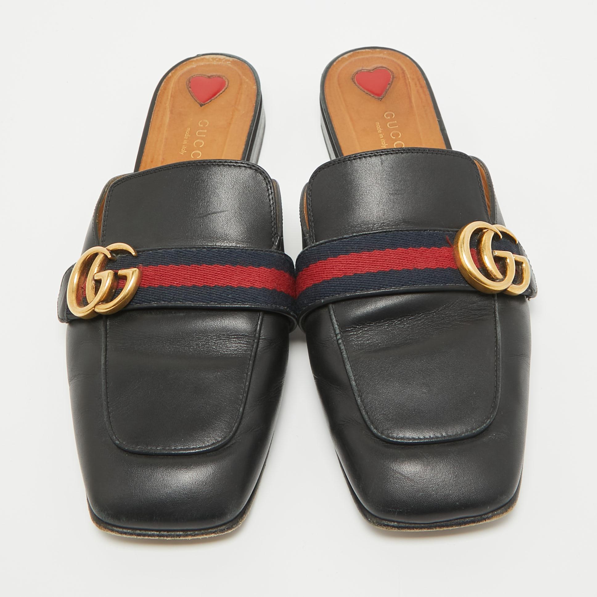 These Gucci Peyton flat mules are easy to style, comfortable, and versatile. Constructed in black leather, this stunning pair of shoes feature covered toes along with the signature Web detailing and GG logo on the uppers.

Includes: Original Box

