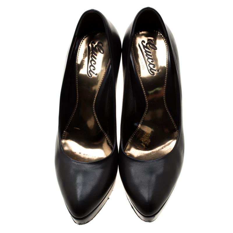 Classy in black, these pumps from Gucci deserve a very special place in your wardrobe! They are crafted from leather and feature covered toes, leather-lined insoles and 13.5 cm heels supported by platforms.

Includes: Original Dustbag, Original Box

