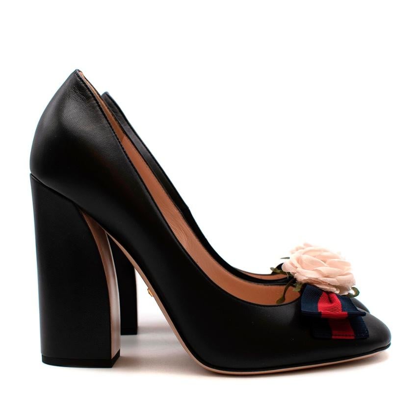 Gucci Black Leather Pumps With Floral Webstripe Bow

-Made of luxurious soft leather
-Gorgeous sculptural chunky heel for stability 
-Iconic red and blue striped ribbon bow and flower detail to the toes 
-Soft leather lining 
-Elegant classic style