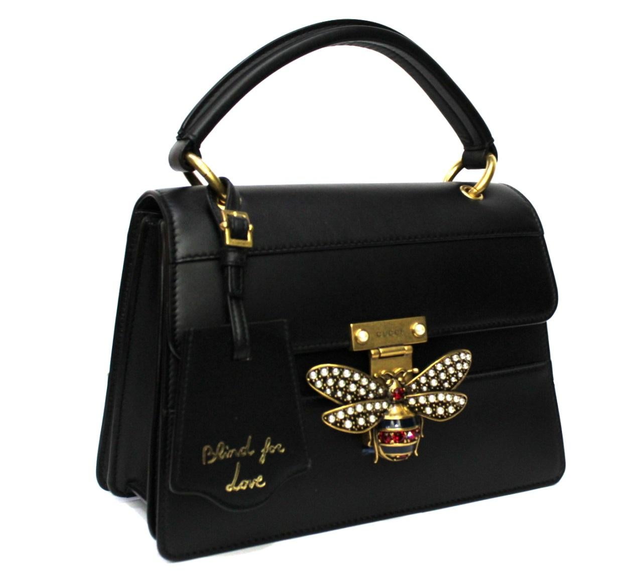 Gucci Queen Margaret in black leather.

Leather handle with fabric and leather shoulder strap.

Gilded hardware, internally capacious.

The bag is in excellent condition.