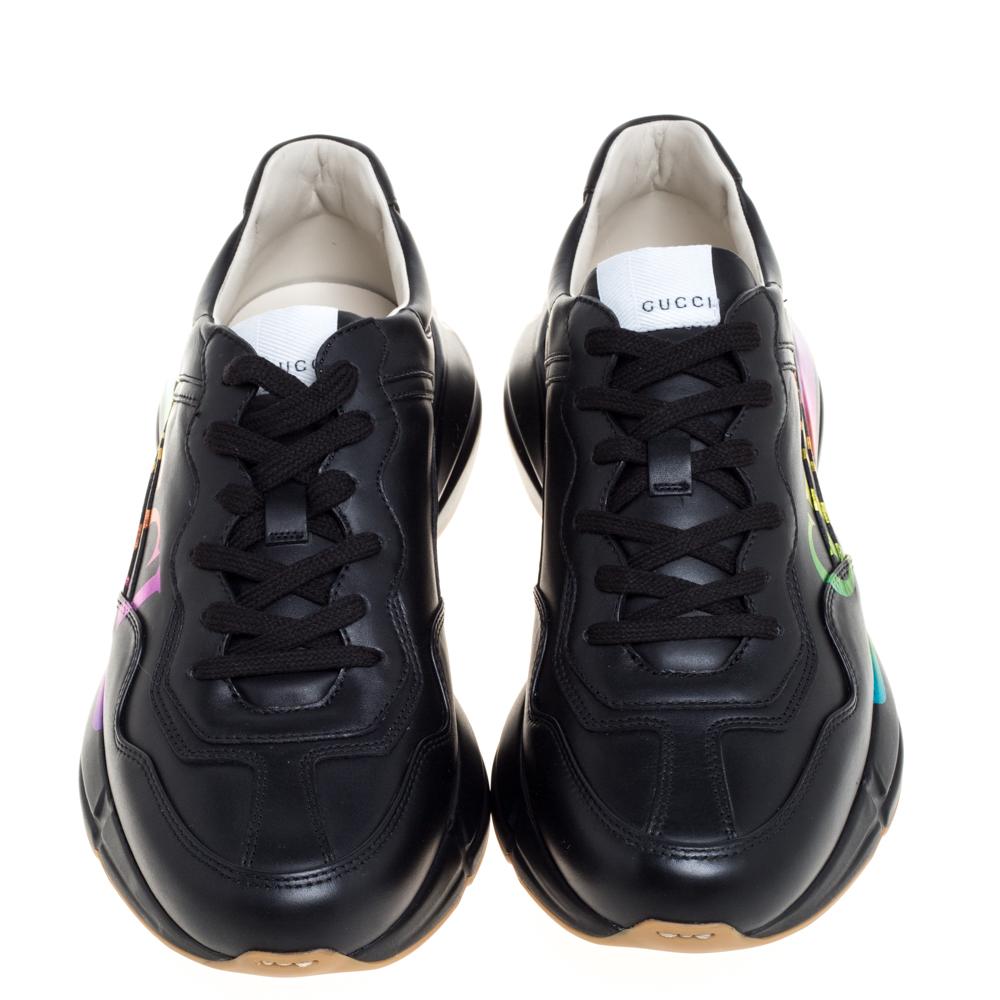 Project a stylish look every time you step out in these Rhyton sneakers from Gucci. They are crafted from black leather and styled with lace-ups on the vamps and the brand logo on the sides. They are equipped with comfortable leather-lined insoles