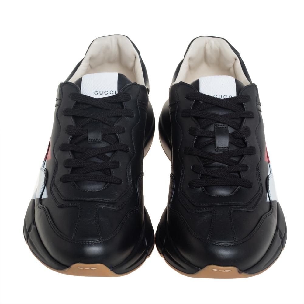 Designed into a chunky size, these Rhyton Gucci sneakers are not just stylish in appeal but also comfortable to wear. Crafted from leather, they are designed with stripes atop a black background on the sides. Finished off with laces on the vamps,