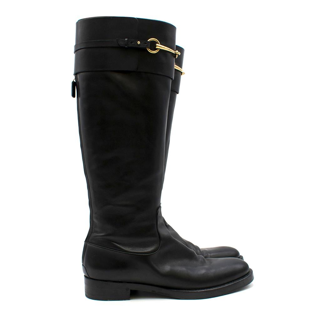 Gucci Black Leather Riding Boots

- Zipper on back
- Gold hardware on calves and zipper
- Low heel
- Shapers included

Please note, these items are pre-owned and may show signs of being stored even when unworn and unused. This is reflected within