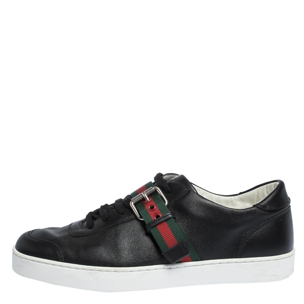 Bring home the luxurious high-fashion touch with these sneakers from Gucci. Crafted from leather, these black sneakers come flaunting suave details like the buckle web stripes, the lace-ups and the label on the heels. You wouldn't want to miss out