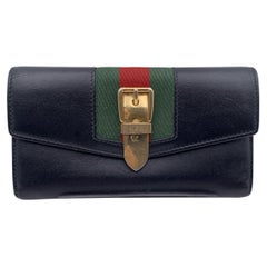 Gucci Sylvie Continental Brieftasche aus schwarzem Leder mit Web- Signatur