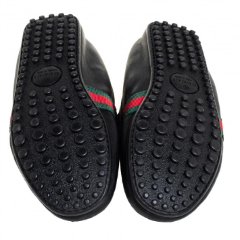 There is nothing more comfortable and stylish than a pair of loafers like these Gucci ones. Fashioned in a neat silhouette, this pair has a black leather body and comes with the signature web detail and penny straps. It is finished with subtle, neat