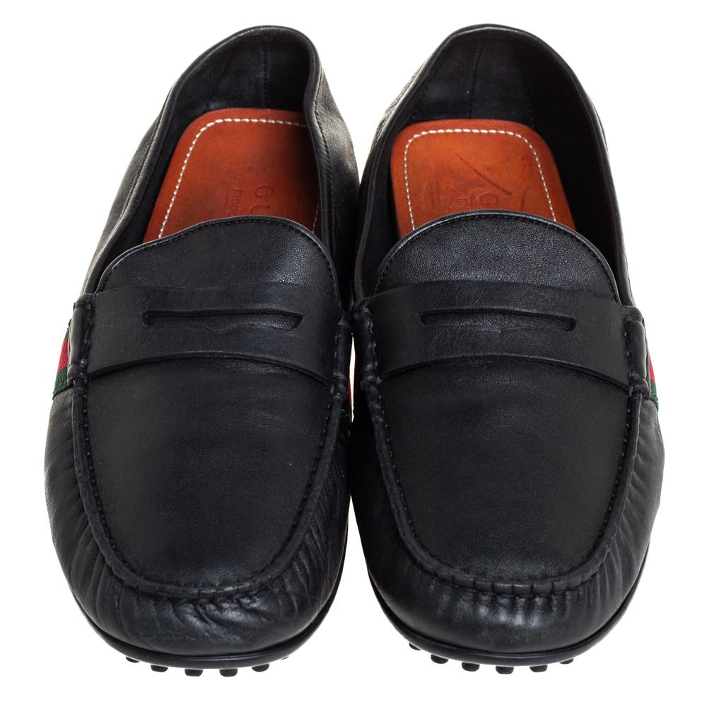 There is nothing more comfortable and stylish than a pair of loafers like these Gucci ones. Fashioned in a neat silhouette, this pair has a black leather body and comes with the signature web detail and penny straps. It is finished with subtle, neat