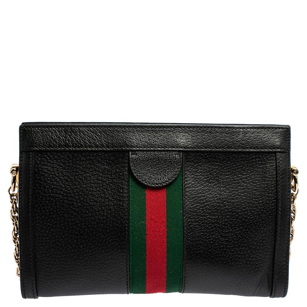 Add to your look by accessorizing with this Gucci bag. Designed expertly, this bag features a black leather body that is enhanced with patent leather trims. The bag flaunts the signature gold-tone GG on the front along with Web trim. It is held by a