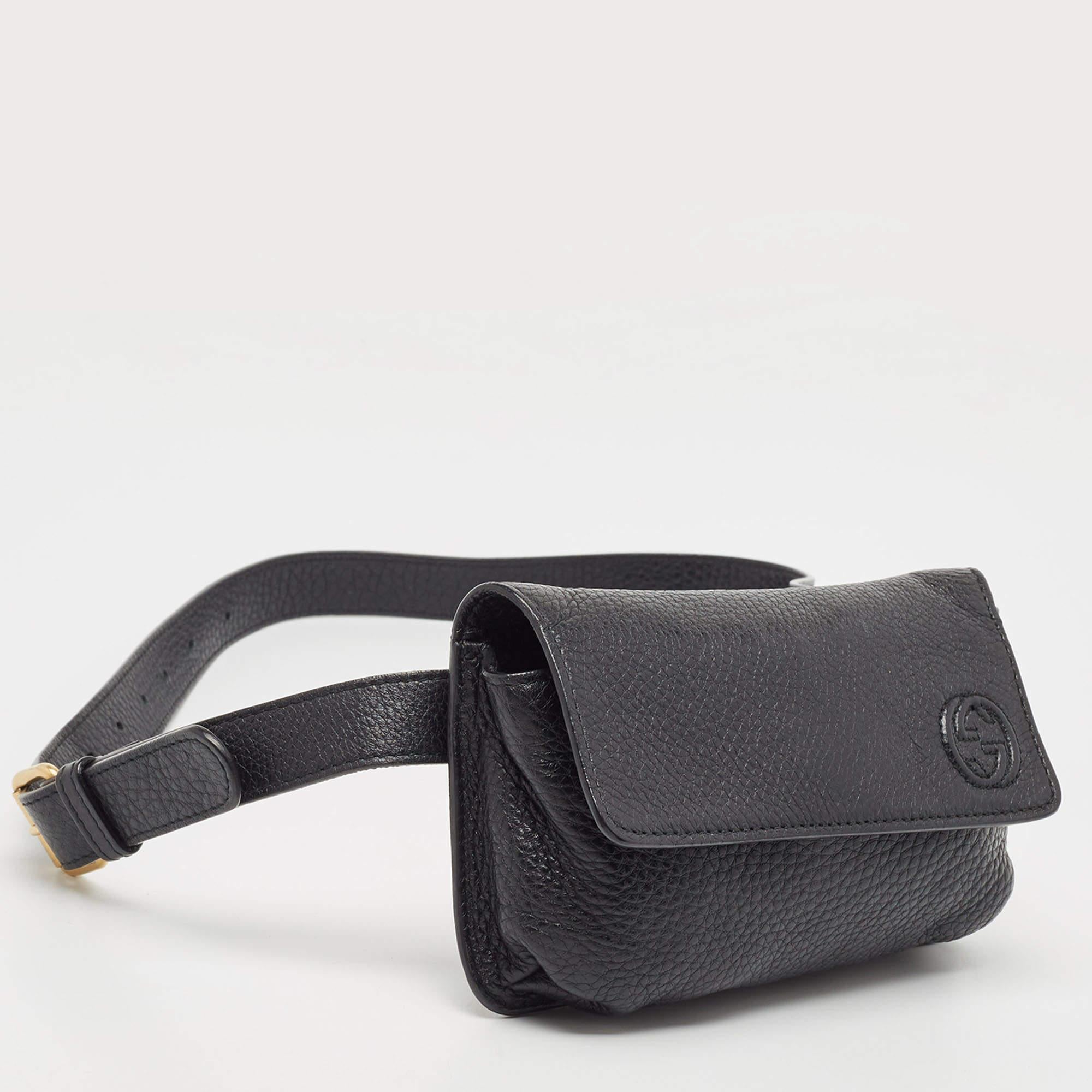 Crafted from supple black leather, the Gucci Soho Belt Bag epitomizes luxury and functionality. With its sleek design and iconic interlocking G logo, it exudes sophistication. This versatile accessory can be worn around the waist or across the body,