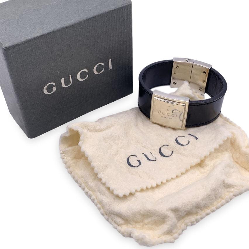 Vintage beautiful cuff bracelet by Gucci. Made in black leather, it features sterling silver parts. 'GUCCI - Made in Italy' engraved on top. Will fit up to approx. 6 inches - 15.2 cm wrist. Width: 0.75 inches - 2 cm.'925' hallmark engraved on the