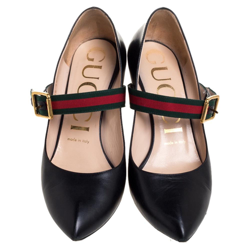 Amp up any outfit with these Gucci Mary Jane Sylvie pumps. Crafted from leather in Italy, they feature the signature web strap with buckle fastening, pointed toes, and sleek stiletto heels. The flattering black shade adds to the appeal of the