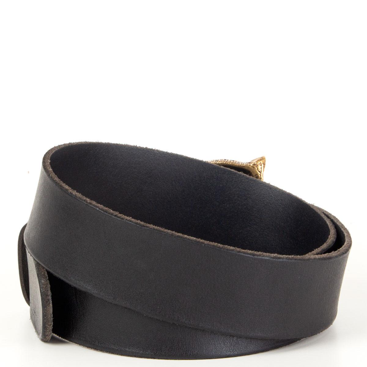 Gucci black leather belt with antique gold-tone tiger head buckle. Has been worn and is in excellent condition. 

Tag Size 90/36
Width 4cm (1.6in)
Fits 85.5cm (33.3in) to 96cm (37.4in)
Length 111cm (43.3in)
Buckle Size Height 8cm (3.1in)
Buckle Size