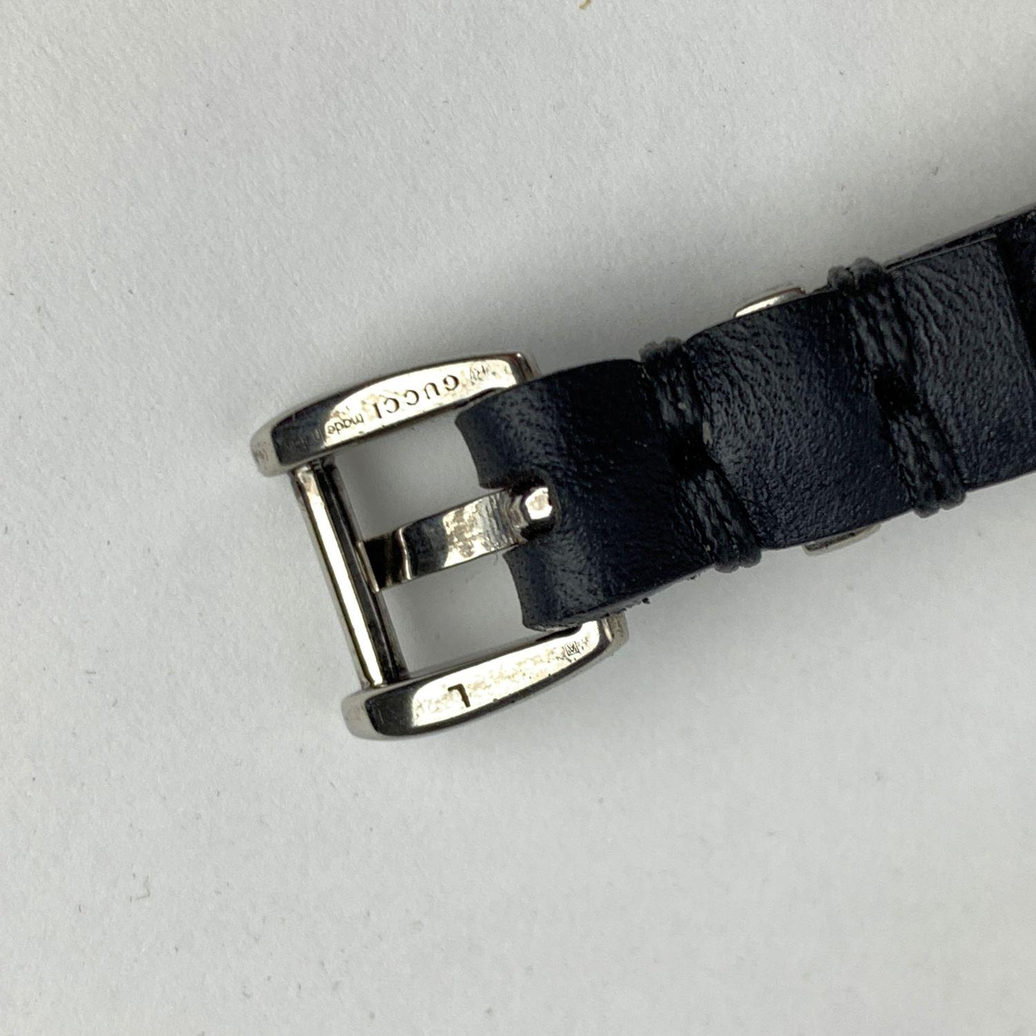 Beautiful belt bracelet by Gucci. Made in black leather, it features aged silver metal tiger head and studs. Buckle closure. 3 holes adjustment. Total length (from end to end): 9.5 inches - 24,1 cm . Max circumference: 7.75 inches - 19.7 cm. Min.